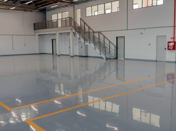Anti slip epoxy floor coating for safer work areas in England Non porous epoxy floors for hygiene control in England